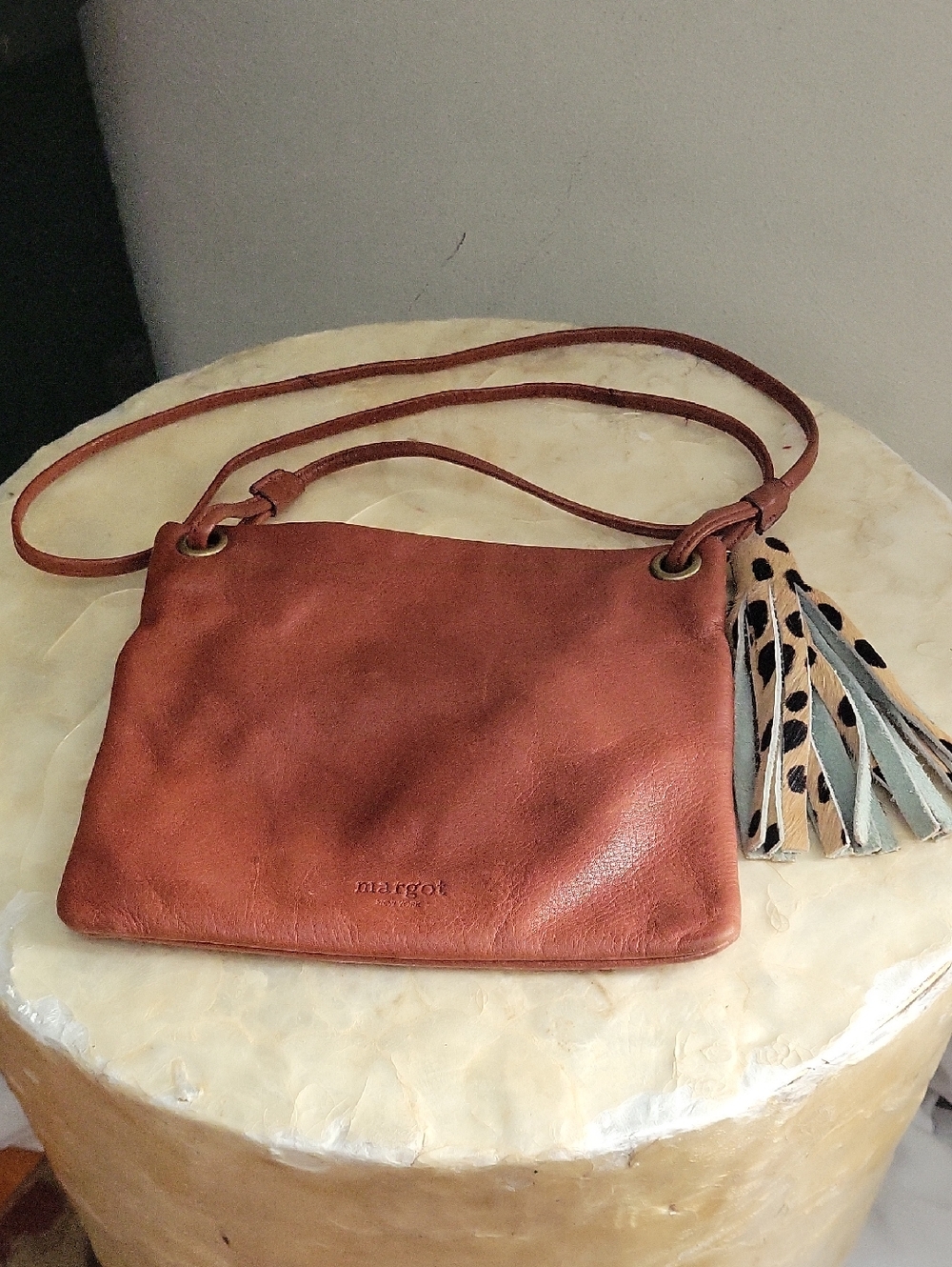 Brown leather crossbody bag by Margot New York. 